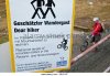 mountain-biker-and-warning-sign-at-hohenweg-station-on-the-parsennbahn-bkfj07.jpg